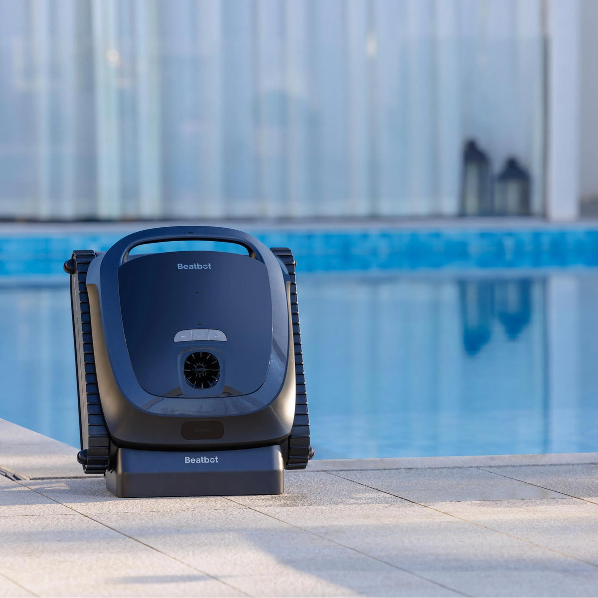 Beatbot AquaSense 2 on its charging dock beside a pool
