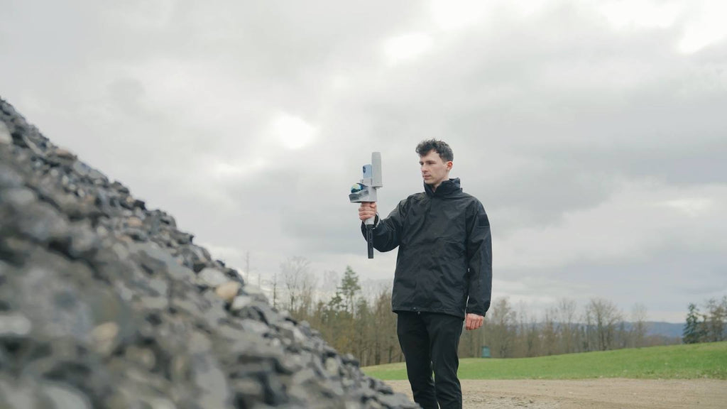 Operator scanning a gravel stockpile with the FJD Trion V4e Go