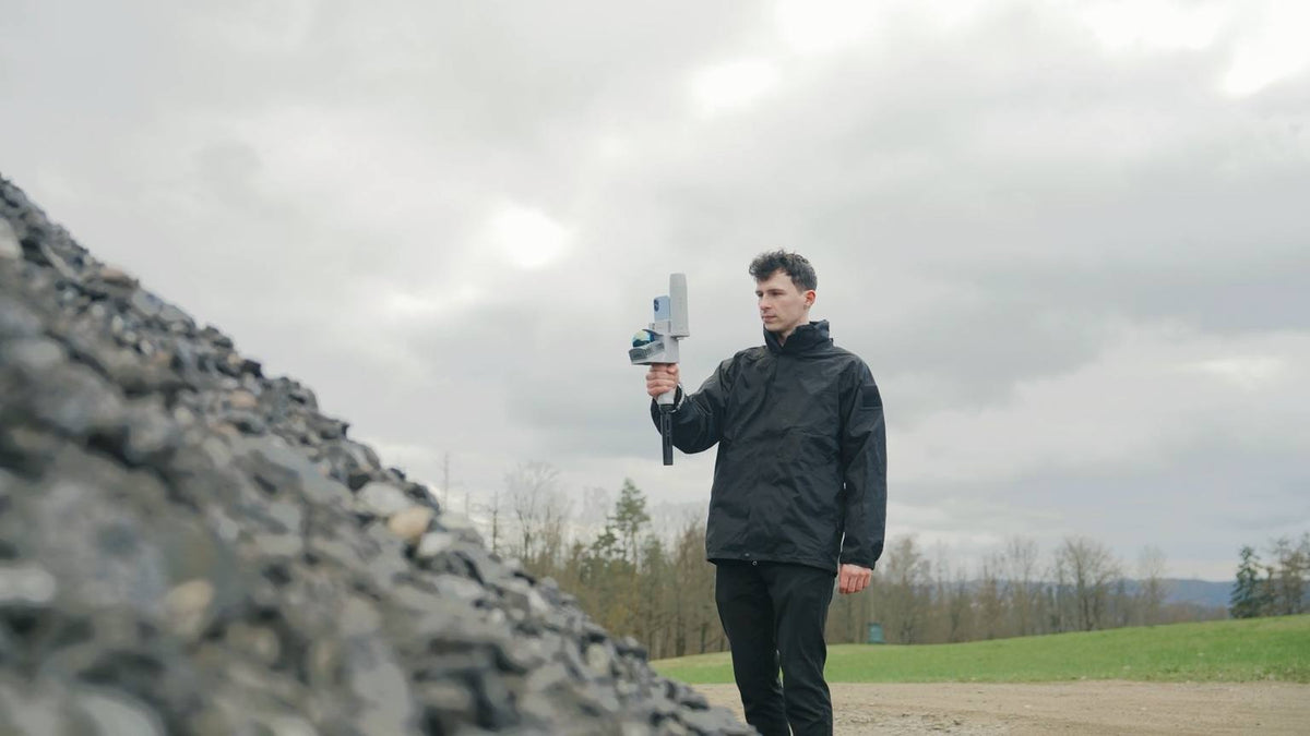 Operator scanning a gravel stockpile with the FJD Trion V4e Go