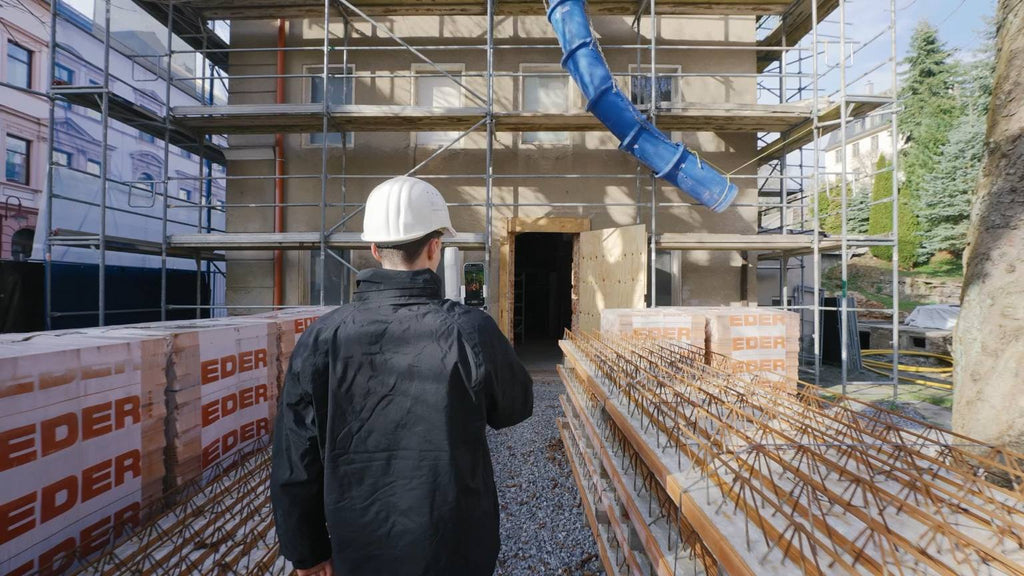 Contractor scanning a building under construction with the FJD Trion V4e Go