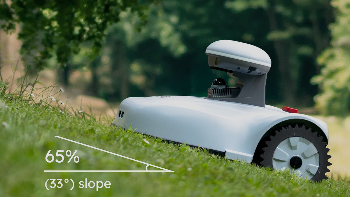 FJD Vela robotic mower climbing a 65 percent slope