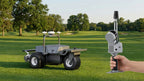 FJD Trion S2 handheld LiDAR scanner on a golf course next to an FJD robotic mower