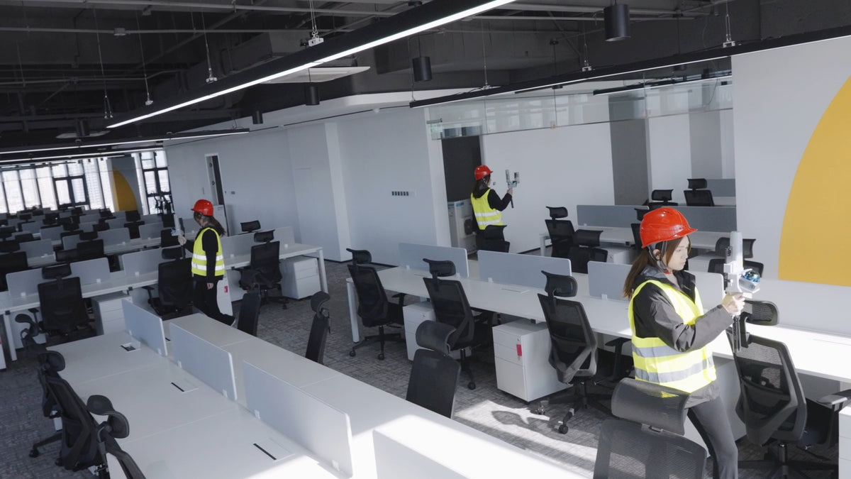 Workers scanning an office interior with the FJD Trion V4e LiDAR