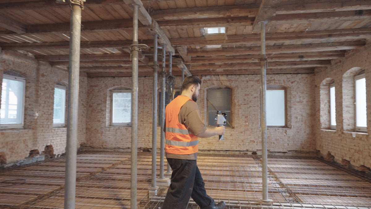 Contractor scanning a building under renovation with the FJD Trion X1