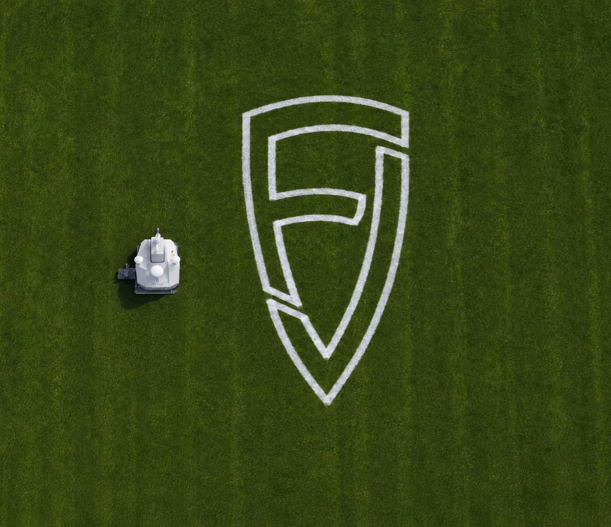 FJD PaintMaster Pro painting a large logo on turf, aerial view