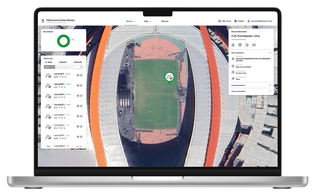 FJD GreenMaster fleet management platform showing a stadium map on a laptop