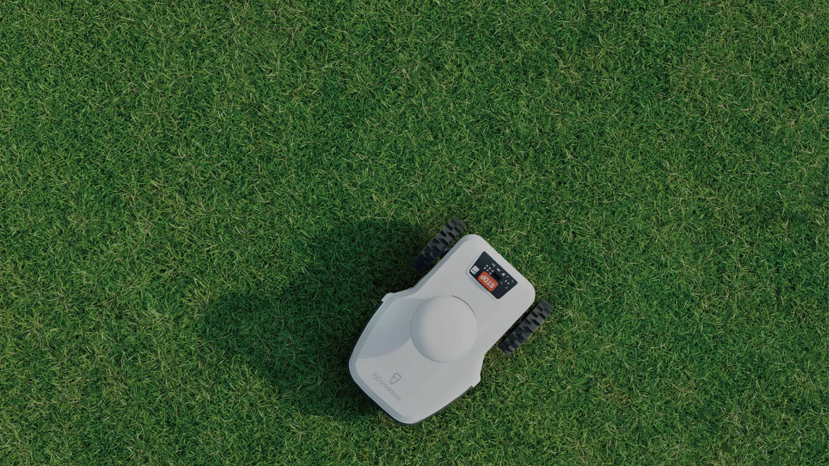 FJD FR4000 robotic mower on grass, top-down view
