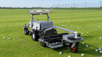 FJD RM21 with BP01 ball picker kit collecting golf balls on a driving range