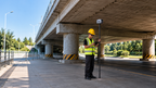 Surveyor using the FJD Trion V100F on a pole under a highway bridge