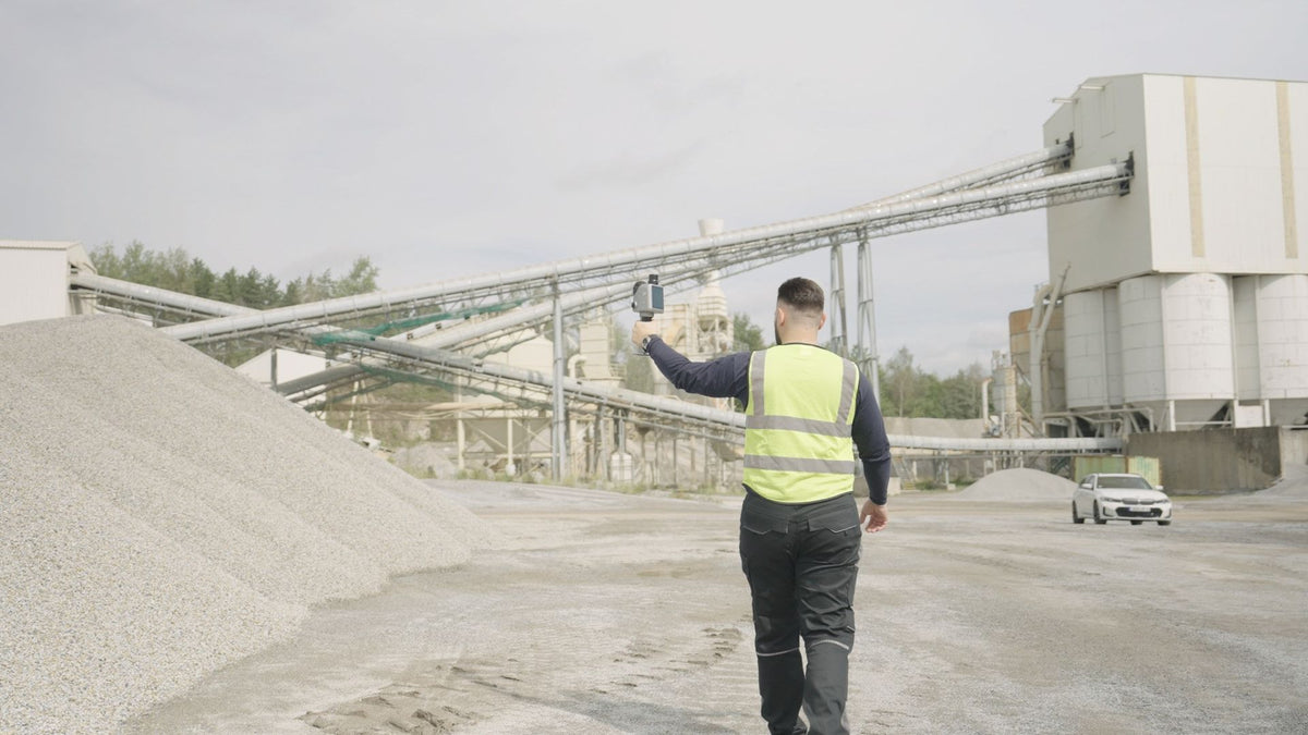 Operator scanning a material yard stockpile with the FJD Trion X1