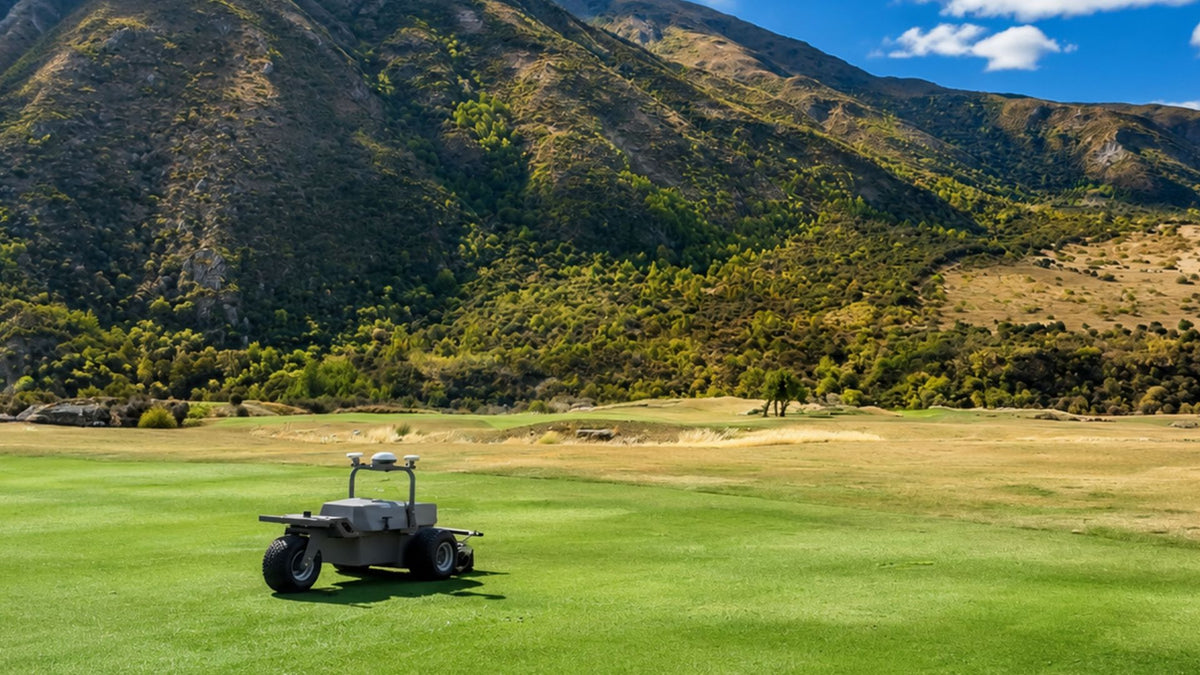 FJD RCM01 robotic cylinder mower on a mountain golf course