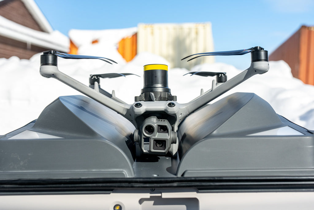 DJI Matrice 4D with AVSS PRS-M4DT parachute seated in a DJI Dock 3