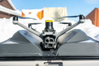 DJI Matrice 4D with AVSS PRS-M4DT parachute seated in a DJI Dock 3