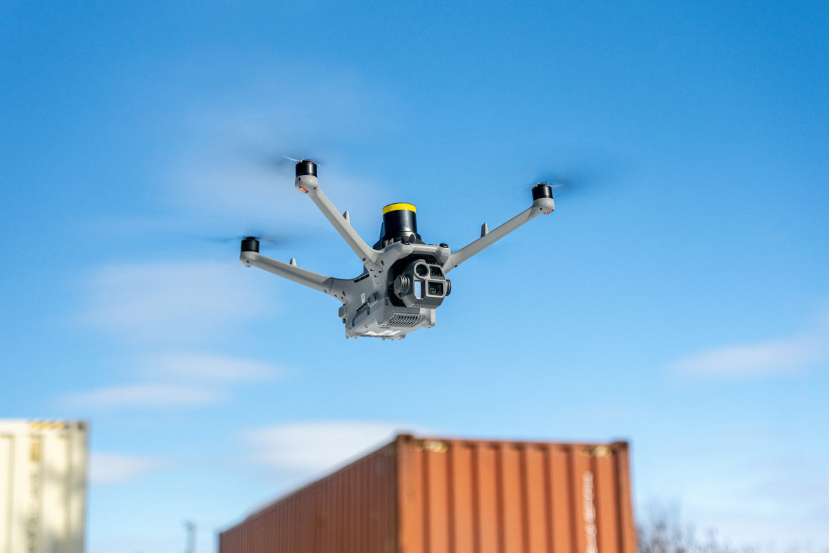DJI Matrice 4D flying with the AVSS PRS-M4DT parachute recovery system mounted on top