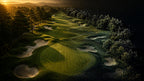 Aerial view of a tree-lined golf hole with bunkers at sunset