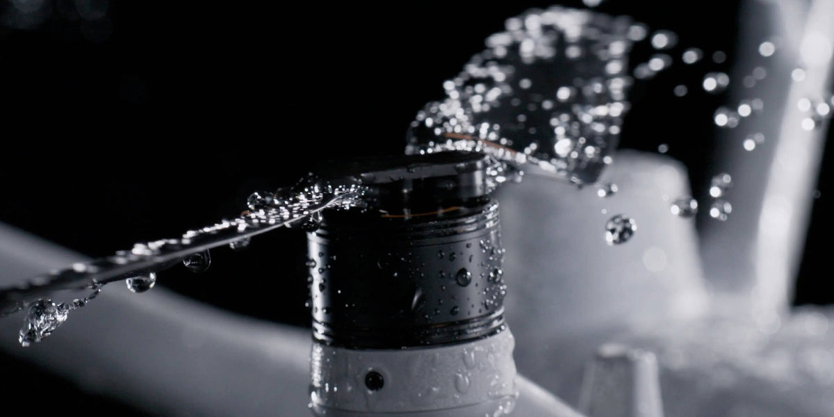 Water spraying over a DJI Matrice 4D series motor, showing IP55 water and dust resistance