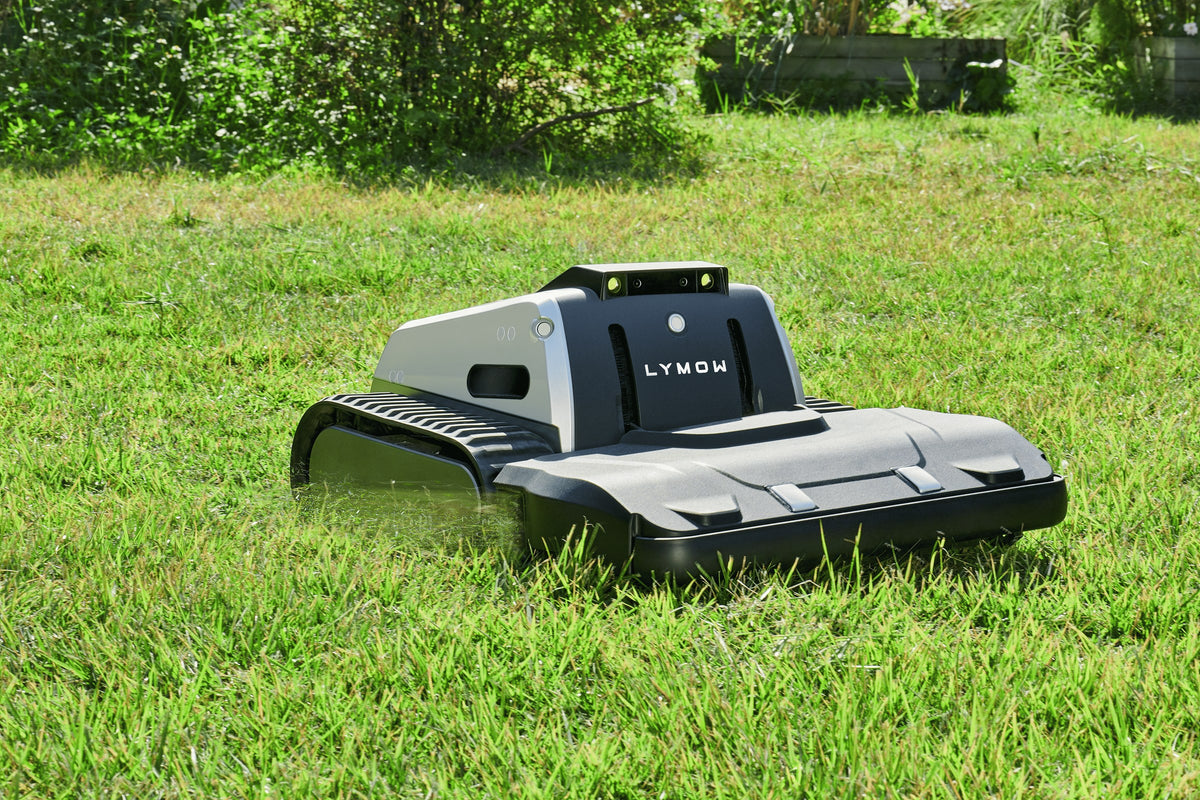 Lymow One Plus mowing tall grass with single-side clipping discharge