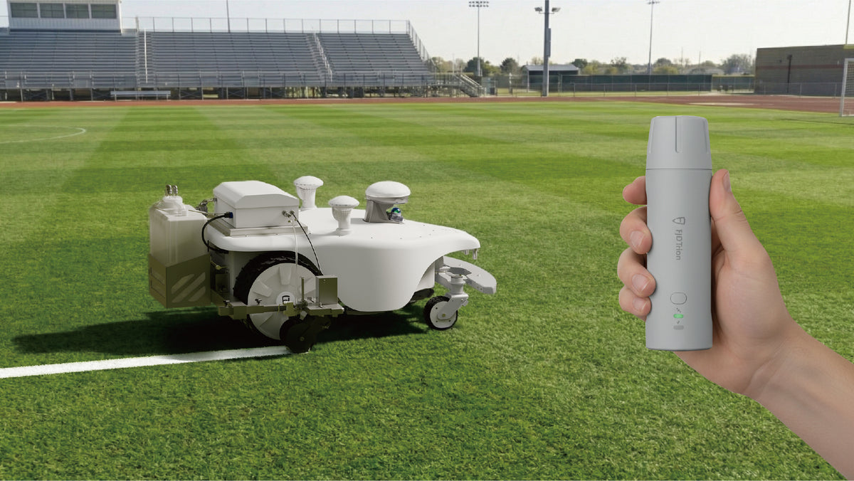 FJD Titan with line marker kit on a sports field